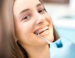 Orthodontist adjusting patient's braces