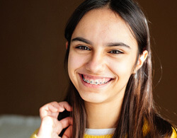 young girl wearing metal braces